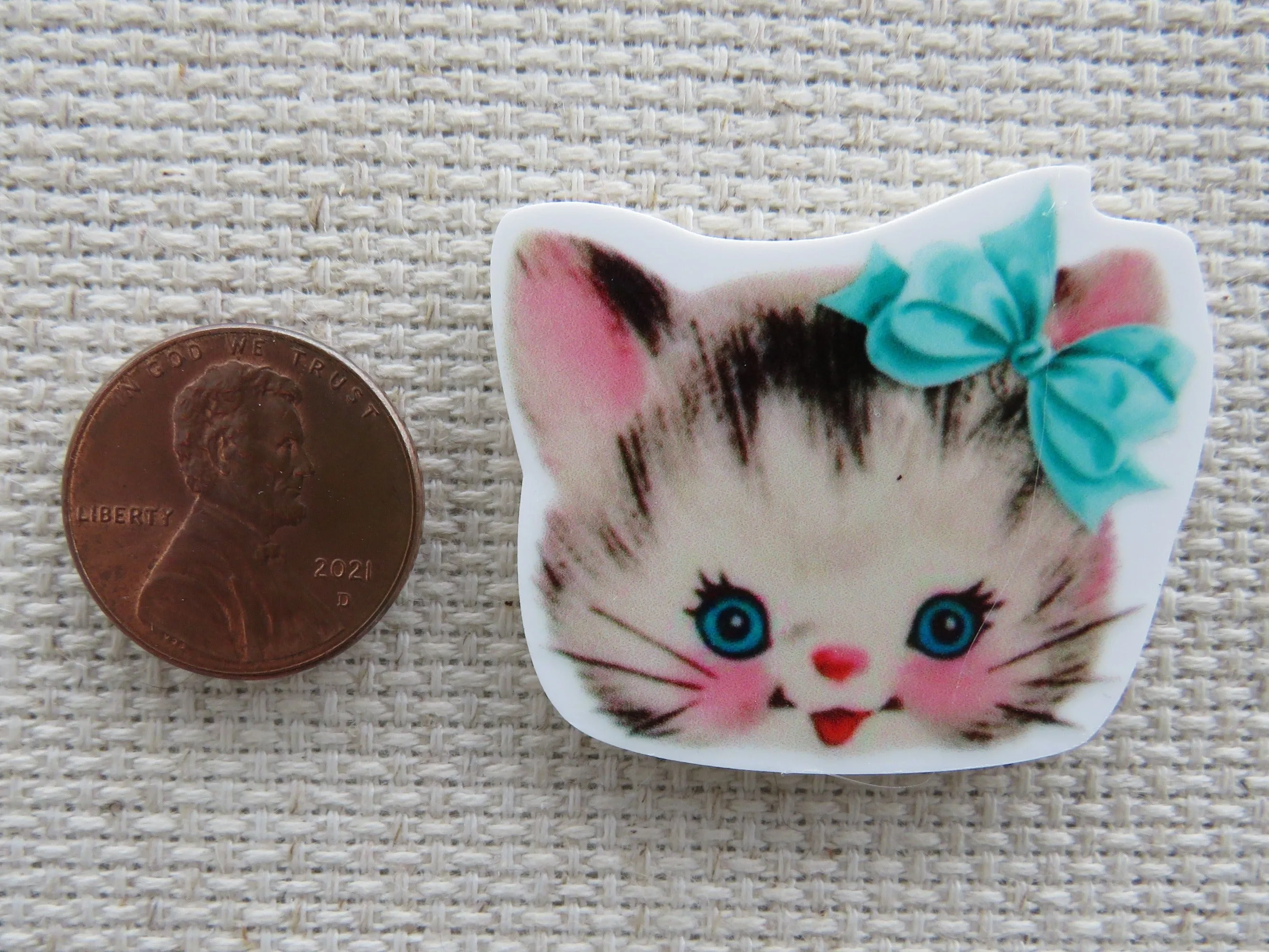 Kitten Face with a Blue Bow Needle Minder, Cover Minder, Magnet